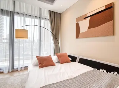 a bedroom with a bed and a large window at Luxe 1BR in RP Heights Downtown - 50mt to Dubai Mall, walk to Burj Khalifa and Fountain in Dubai