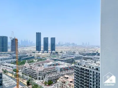 an aerial view of a city with tall buildings at Stylish 1BR Retreat in Binghatti Amber l Balcony in Dubai