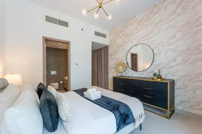 a bedroom with a large bed and a mirror at Unique & Stunning Marina Views LIV Residence 2BR in Dubai