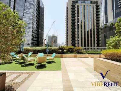 a patio with chairs and tables in a city at Hotel Apartment next to Dubai Mall,Views & Vibes in Dubai