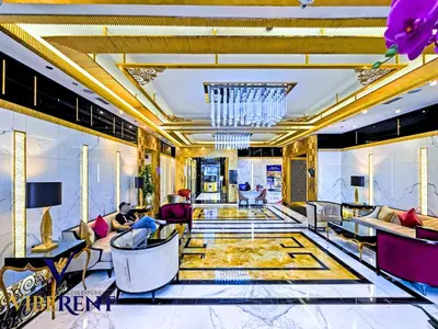 a living room filled with furniture and a chandelier at Hotel Apartment next to Dubai Mall,Views & Vibes in Dubai