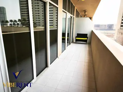 a corridor of an office building with large windows at Damac 1BHK, Terrance Pool, 20 Min to Downtown in Dubai
