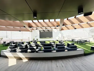 a conference room with chairs and a projection screen at Vogue Arjan Opalz by Danube near Science Park, Studio Apartment with Balcony and Vibrant Community View, Access to all Amenities in Dubai