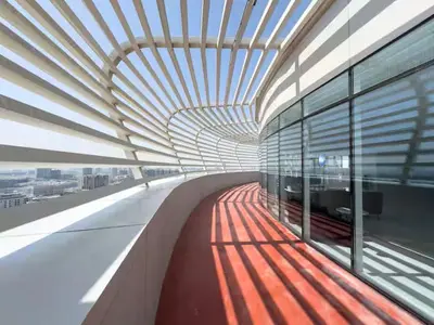 a view of a building with a view of a train at Vogue Arjan Opalz by Danube near Science Park, Studio Apartment with Balcony and Vibrant Community View, Access to all Amenities in Dubai