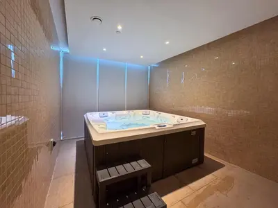 a bathroom with a jacuzzi tub in a room at Vogue Arjan Opalz by Danube near Science Park, Studio Apartment with Balcony and Vibrant Community View, Access to all Amenities in Dubai