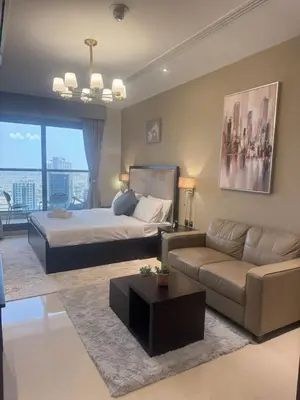 a large bedroom with a bed and a couch at Dubai Downtown Canal View Studio 2306 in Dubai