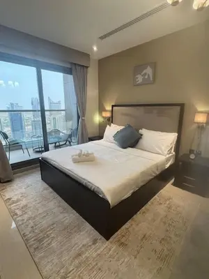 a bedroom with a large bed and a large window at Dubai Downtown Canal View Studio 2306 in Dubai