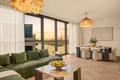 a living room with a couch and a table at Seraya at Dubai Creek South Residence in Dubai