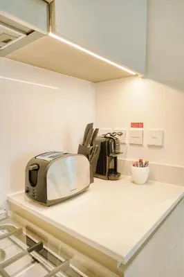 a toaster sitting on a counter in a kitchen at PVH - Charming 1 BR - Lotus Creek Beach in Dubai