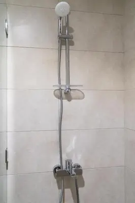 a shower with a shower head in a bathroom at Business Bay 1br with High-Floor Views in Dubai
