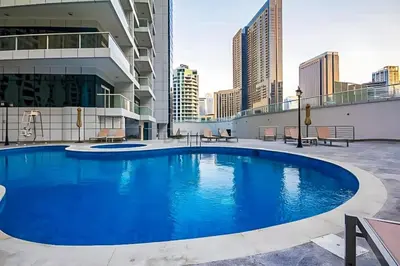 a large swimming pool on the roof of a building at Seamless Access to Marina Mall, JBR Beach, Dining And Shopping Spots, Just A Few Meters from the Tram Station - Continental Tower, Dubai Marina by Deluxe Holiday Homes in Dubai