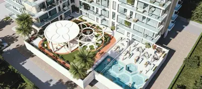 an overhead view of a building with a swimming pool at Stylish 1-Bedroom Apartment in Dubai