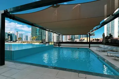 a swimming pool on the roof of a building at Mahogany 17 - 2BR 10PAX - On the Boulevard Sea View in Dubai