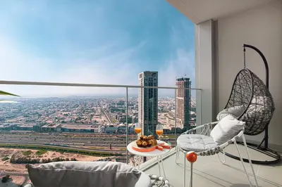 a living room with a view of a city at Trendy 2BR Apartment near Burj Khalifa, Downtown Dubai in Dubai