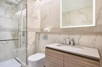 a bathroom with a toilet and a sink and a shower at STAY BY LATINEM Luxury 2BR Holiday Home OPA 305 Near Downtown in Dubai