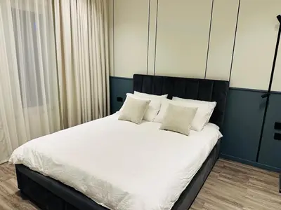 a bedroom with a large bed with white sheets and pillows at Luxury 4 Bedroom Villa The Springs Dubai in Dubai