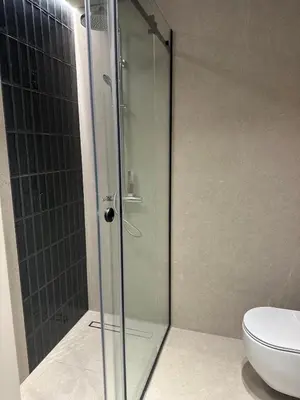 a glass shower in a bathroom with a toilet at Luxury 4 Bedroom Villa The Springs Dubai in Dubai