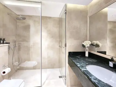 a bathroom with a sink and a shower at SOLARTE Luxe - New Large 2BR - Marina Promenade - Sea Views - Super King Bed & Workspace in Dubai