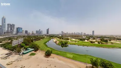 an aerial view of a golf course with a city at bnbmehomes - Vida Residence A1 in Dubai