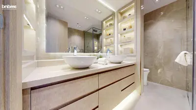 a bathroom with two sinks and a shower at bnbmehomes - The Lofts Central in Dubai