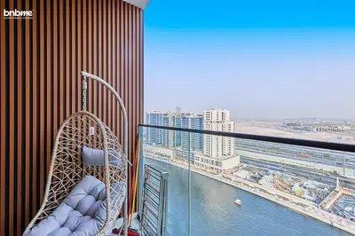 a balcony with a swing and a view of a city at bnbmehomes - Trillionaire Residences By Binghatti in Dubai