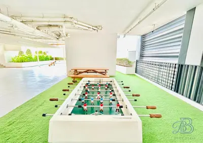 a game room with a pool table on the floor at Stylish 2 Bedroom Apartment in the Heart of JVC - with swimming pool, fully equipped gym, outdoor steam room, kids play area & lots more in Dubai