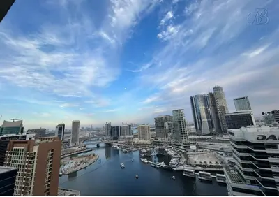 a view of a city with a river and buildings at 2 Bedroom Apartment with Canal View in Business Bay in Dubai