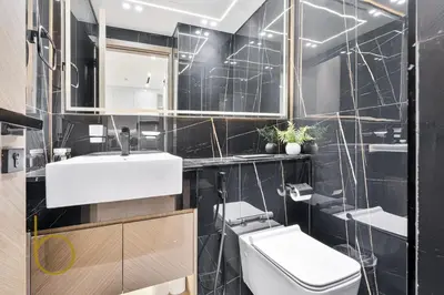 a bathroom with a white sink and a toilet at Bookable - 1 Bedroom Binghatti Crescent in Dubai