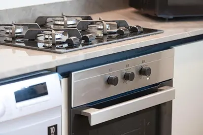 a kitchen with two burners on a stove at 2 Bedroom Apartment in Business Bay Gym, Pool & View in Dubai