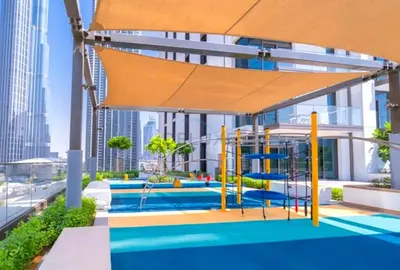 a playground in a building with a large canopy at Boulevard Views, Steps from Burj Khalifa & Dubai Mall, Near Metro Station and Few Mins Drive to Dubai Marina - Burj Crown, Downtown Dubai by Deluxe Holiday Homes in Dubai