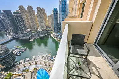 a balcony with a view of a river and buildings at One Bed Marina View on 34th floor in Dubai