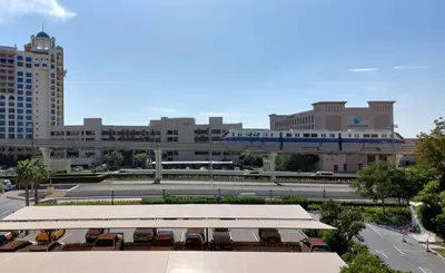a view of a city with a train station and buildings at Luxury studio with full sea view in Dubai