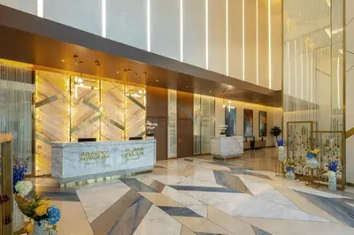 a lobby of a building with a reception desk at Steps from Dubai Water Canal 2BR, Near Safa Park & SZR, Easy Downtown Access, Aykon City 2 Tower C, Business Bay by Deluxe Holiday Homes in Dubai