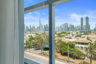 a view from a window of a city skyline at Stunning 1BR Canal Front Residence near Downtown in Dubai