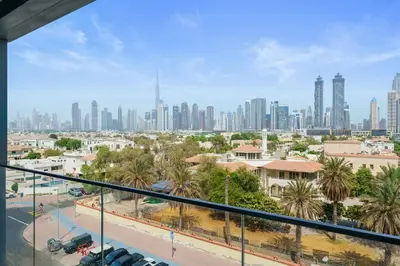 a view of the city from the balcony of a building at Stunning 1BR Canal Front Residence near Downtown in Dubai
