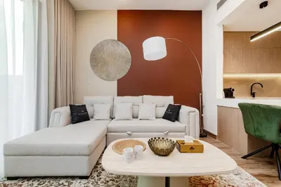 a living room with a couch and a table at Oakley Square 1BR Apartment with maid's room in Dubai