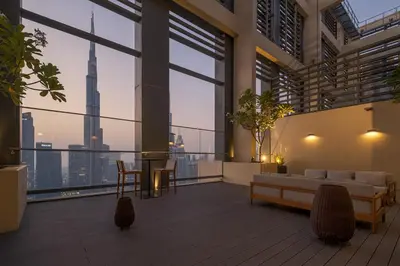 a living room with a view of the city at Downtown Pulse Artful 1BR with Dubai Mall Access by Maxx Value Homes in Dubai
