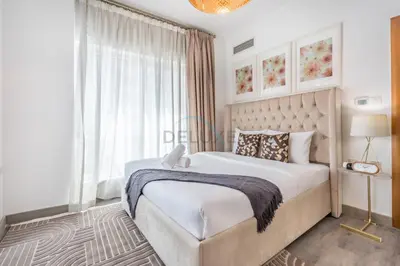 a bedroom with a large bed and a large window at Metro-Accessible 2BR, Easy Reach to Marina Mall and JBR Beach, Featuring Stunning SZR & City Views, Marina Diamond 2, Dubai Marina by Deluxe Holiday Homes in Dubai