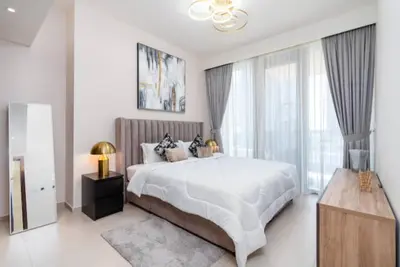 a bedroom with a large bed and a large window at Guest Favorite - Modern and Upgraded 2BR Heart of Downtown in Dubai