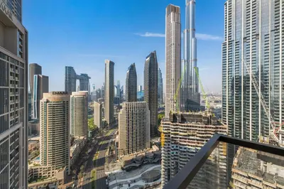 a view of a city skyline with tall buildings at Guest Favorite - Luxury 2BR with Full Burj Khalifa View Downtown in Dubai