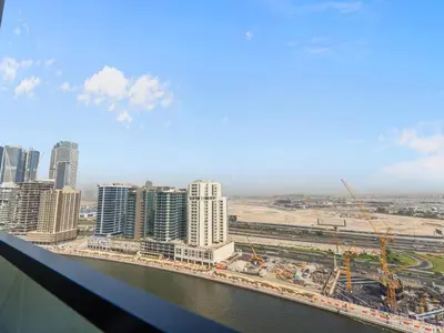 a view of a city with a river and buildings at Mesmerizing Canal View Studio in Trillionaire in Dubai