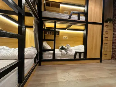 a room with two bunk beds and a mirror at Luxury Hostel Bedspace in Downtown Near Emirates Towers Metro in Dubai