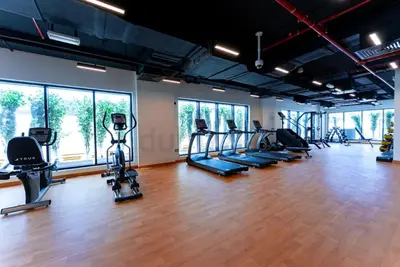 a gym with treadmills and elliptical machines at Luxury Hostel Bedspace in Downtown Near Emirates Towers Metro in Dubai