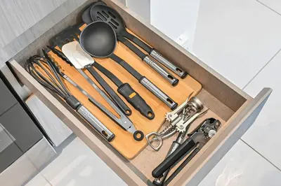 a drawer filled with cooking utensils in a kitchen at Stylish 2BR Downtown Dubai in Dubai