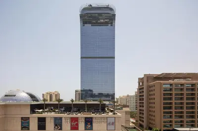 a tall building in the middle of a city at Beachfront Studio at West Beach in Dubai