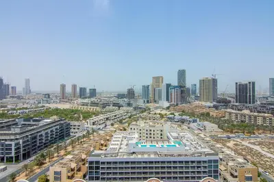 an aerial view of a city with tall buildings at Brand New 1 Bedroom in AURA by Grovy, JVC in Dubai