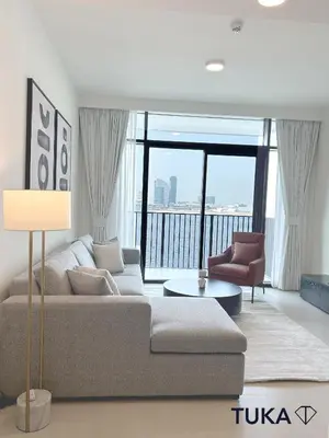 a living room with a couch and a table at Canal View - 2-BHK - Creek Harbour - Central - Lux in Dubai