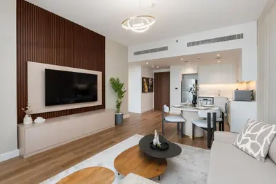 a living room with a couch and a dining room at Madinat Jumeirah Living 1 Bedroom Holiday Rental in Jadeel 3 - DVH Holiday Homes in Dubai