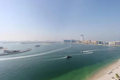 an aerial view of a body of water with boats at Sea View 2B Beachfront Luxury Emaar Beachfront in Dubai