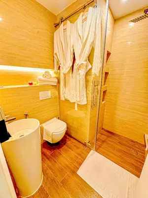 a bathroom with a shower and a toilet and a sink at Barsana - Premier 3Bed Suite - Marina & Sea Views in Dubai